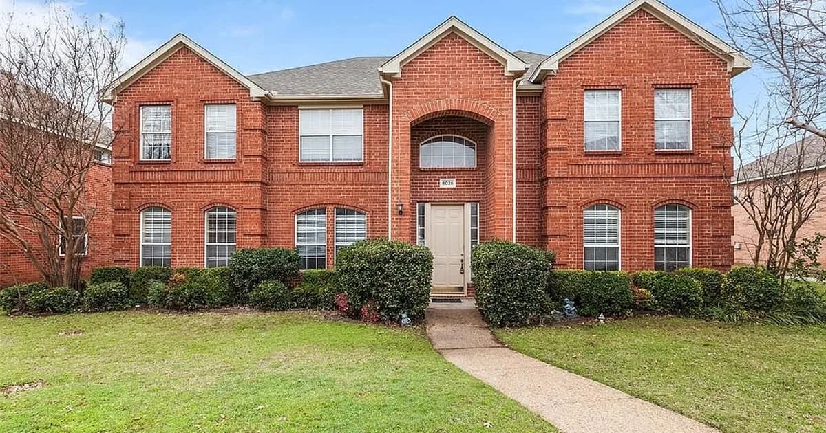 Brick single-family rental home in a Dallas–Fort Worth suburb — choosing the best DFW property manager in 2026