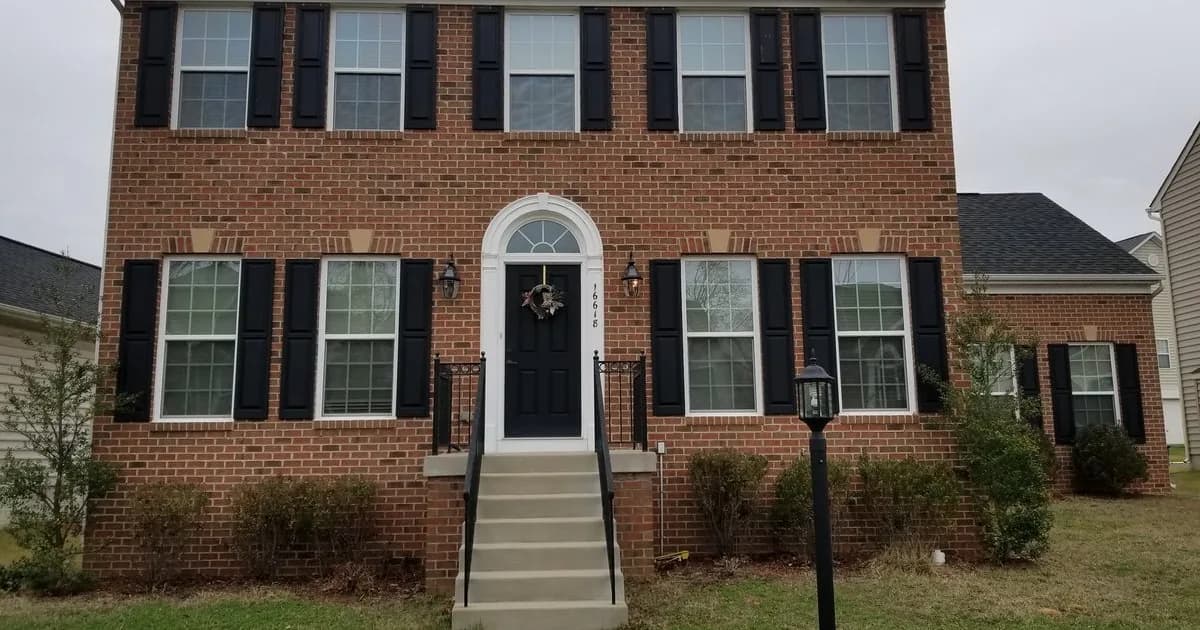 Brick colonial rental home in the Washington DC, Maryland, and Virginia region — a DMV landlord law comparison for cross-border owners