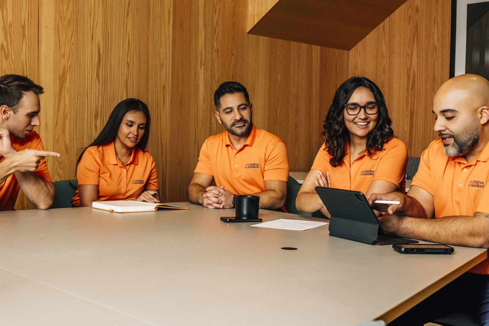 The Flat Fee Landlord team reviewing a tenant application together