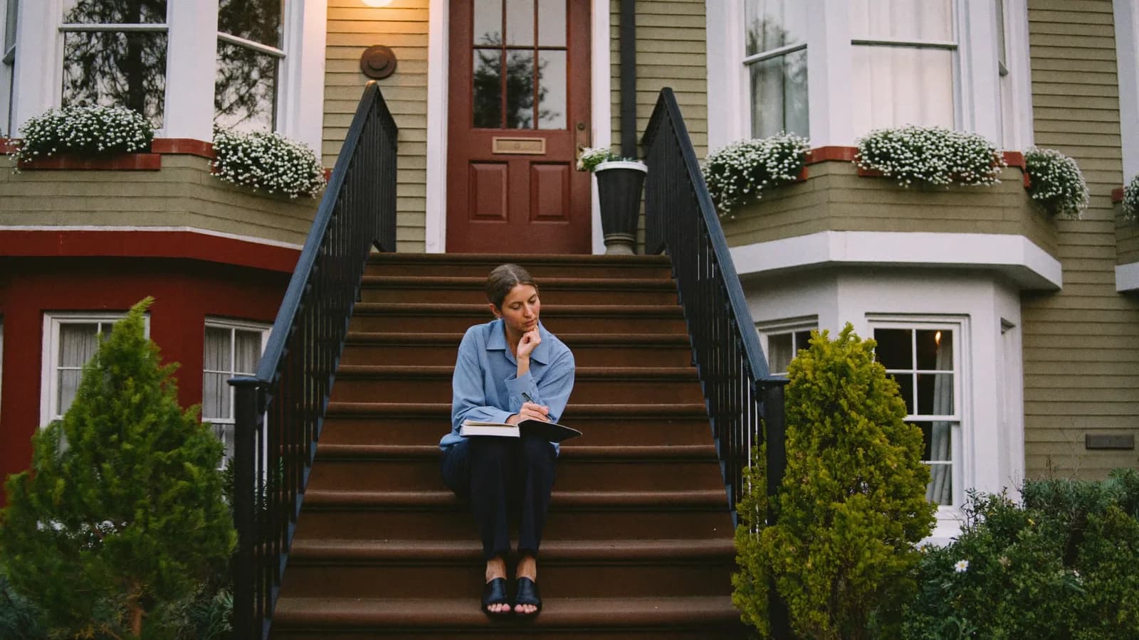 Richmond landlord going over rental income and management costs at a desk in a historic Virginia home