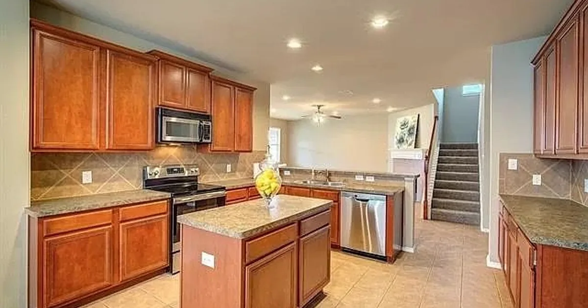 Richardson single-family rental home with established Telecom Corridor character in golden afternoon light — the Richardson ISD attendance-zone rental stock anchoring UT Dallas, AT&T Network Operations, and DFW Telecom Corridor demand
