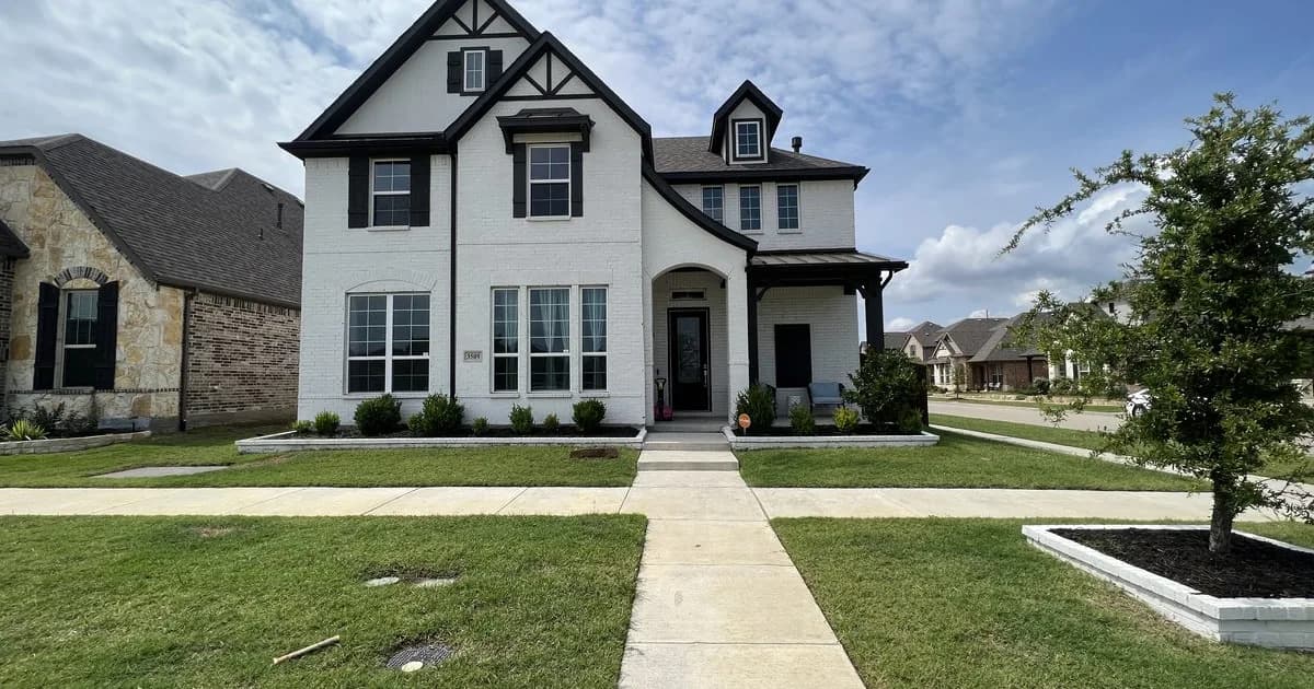 Premium Southlake single-family rental home with mature landscaping and high-end finishes in golden afternoon light — the Carroll ISD attendance-zone rental stock anchoring DFW corporate-relocation executive demand and family relocations driven by Southlake Carroll Dragons district reputation