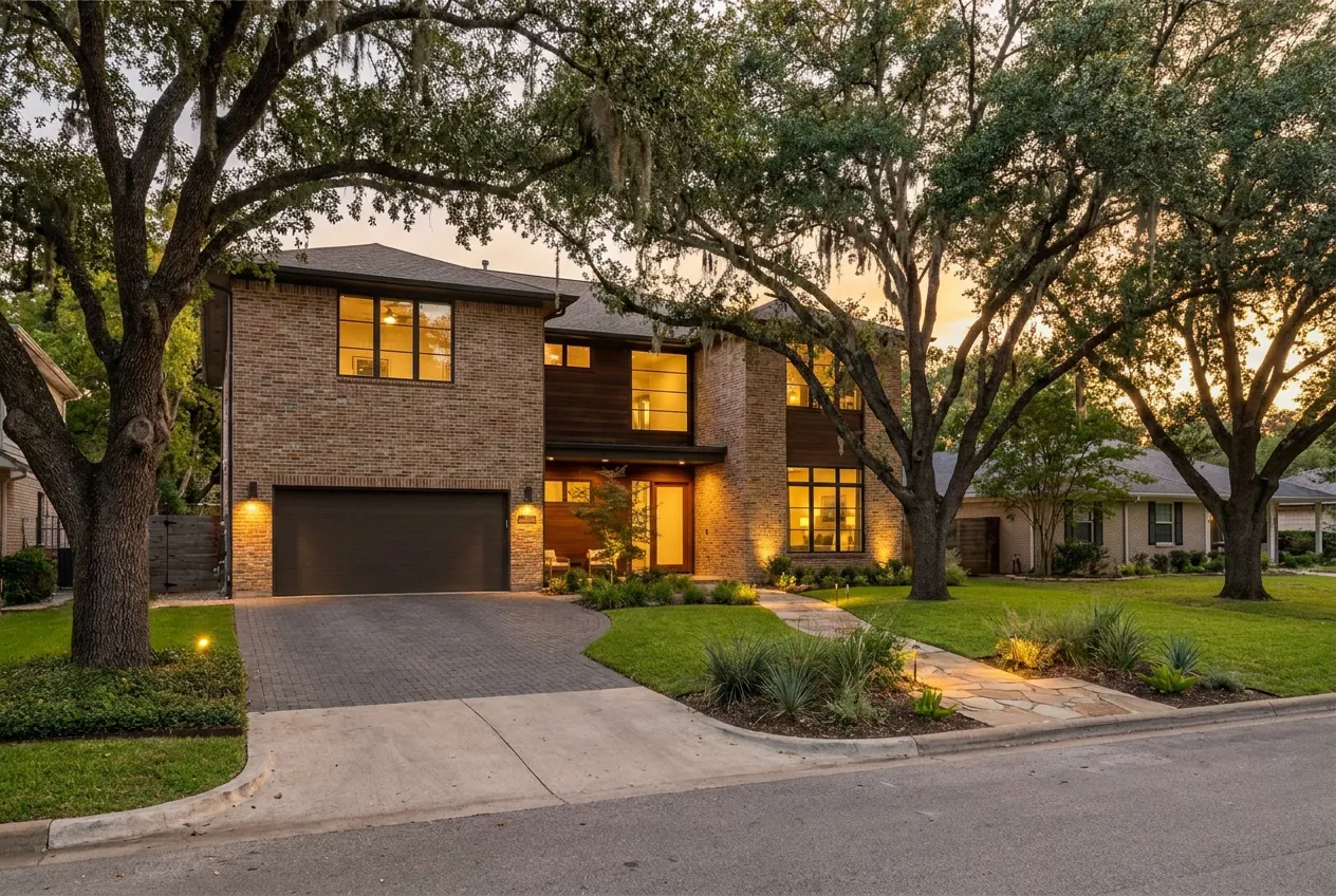 Single-family rental home in a Dallas-Fort Worth suburb at golden hour with mature oak trees and a manicured lawn